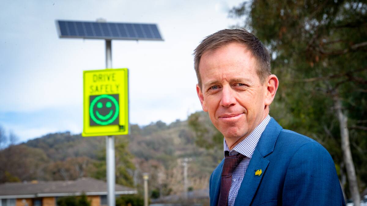 Road Safety Minister Shane Rattenbury with the smiley face road sign. Picture: Elesa Kurtz