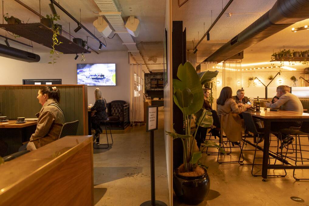 Assembly in Braddon used partitions and curtains to divide the bar's interior space during COVID restrictions. Picture: Sitthixay Ditthavong