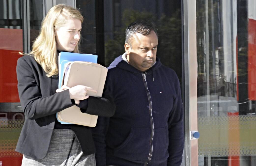 Gopalakrishnan Suryanarayanan Vilayur, right, who is charged with conspiring to defraud the Commonwealth and abuse of public office. Picture: Blake Foden