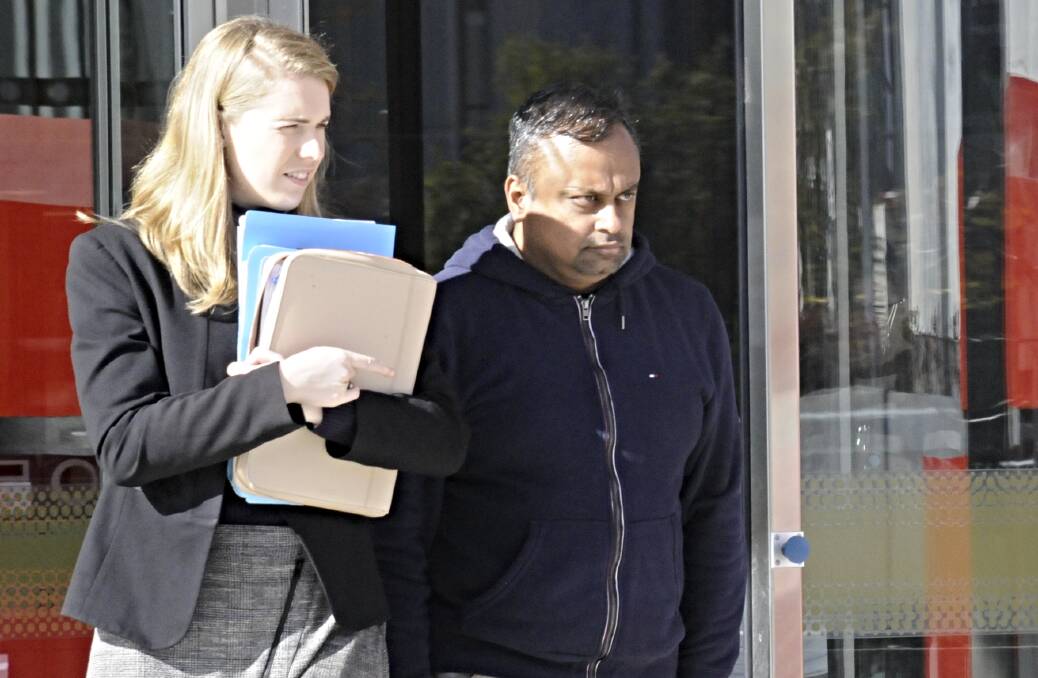 Gopalakrishnan Vilayur, right, outside court the day after his arrest. Picture: Blake Foden
