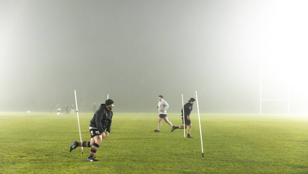 Gungahlin Eagles rugby players are braving the cold with an eye on a return to rugby. Picture: Sitthixay Ditthavong