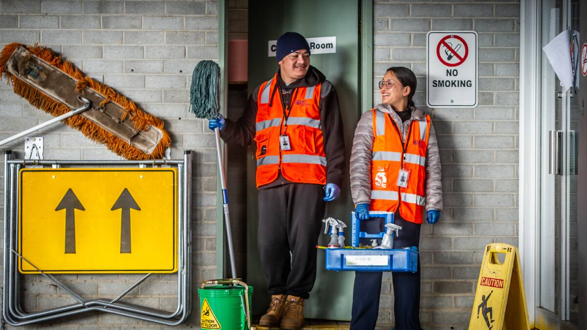 Nima Sherpa, left, and Radha Lima, a couple originally from Bhutan, have both been employed as cleaners as part of the ACT government's stimulus jobs plan. Picture: Karleen Minney