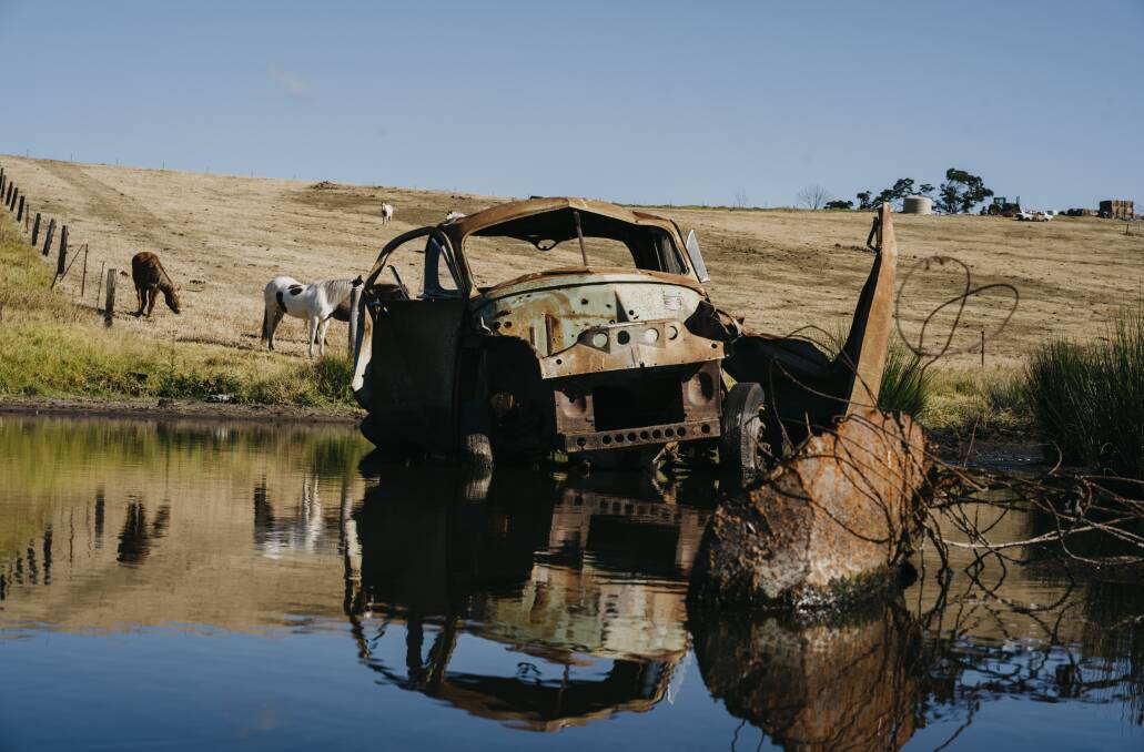 The FJ ute, flung down the hill from the firestorm at Jade Corbys' parents property at Wandella, at the start of the year. Picture: Dion Georgopoulos 