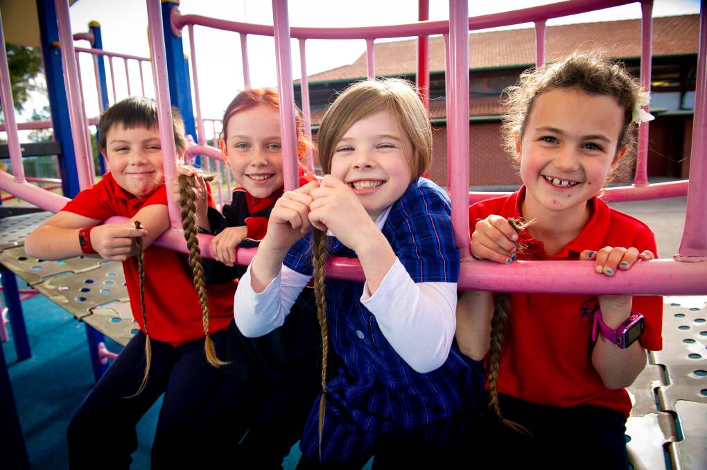 Isobel Ashcroft, 8, (second from right) pictured with year 3-4 school friends Brodey Lukasiak, Maddie Griffin and Eloise Varley, after her hair cut on Thursday Picture: Elesa Kurtz 