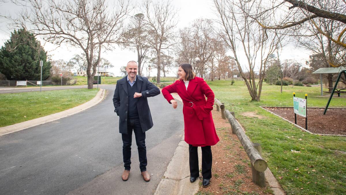ACT Chief Minister Andrew Barr elbow bumps with Labor's candidate for Eden-Monaro Kristy McBain in Murrumbateman on Monday. Mr Barr says the ACT could move to the next stage of easing coronavirus restrictions by July 9. Picture: Karleen Minney