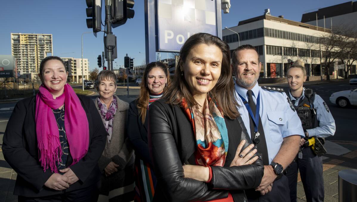 Intermediaries (l-r) Sarah Cocco and Jenny, assistant director Laura Cilesio, program director Kath Taplin, inspector Ross Williams and constable Kristen Steele outside Woden police station. Picture: Sitthixay Ditthavong 