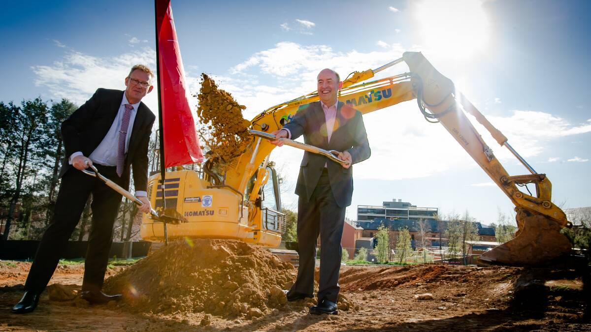 Liberal MLA Mark Parton and Morris Property Group director Barry Morris at a sod-turning ceremony to mark the start of construction at the former Stuart Flats site in Griffith. Picture: Elesa Kurtz 