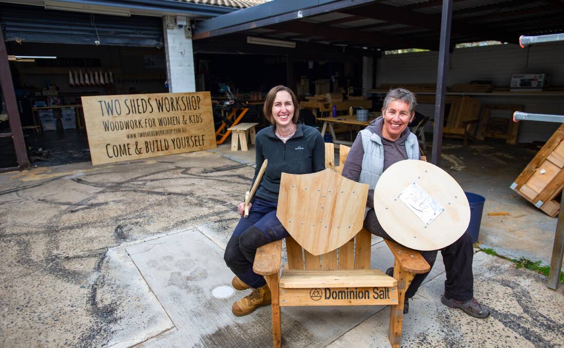 Two Sheds Workshop woodwork teachers Leanne Kell and Miche Hodgetts, with old burnout marks from the Rebels. Picture: Elesa Kurtz 