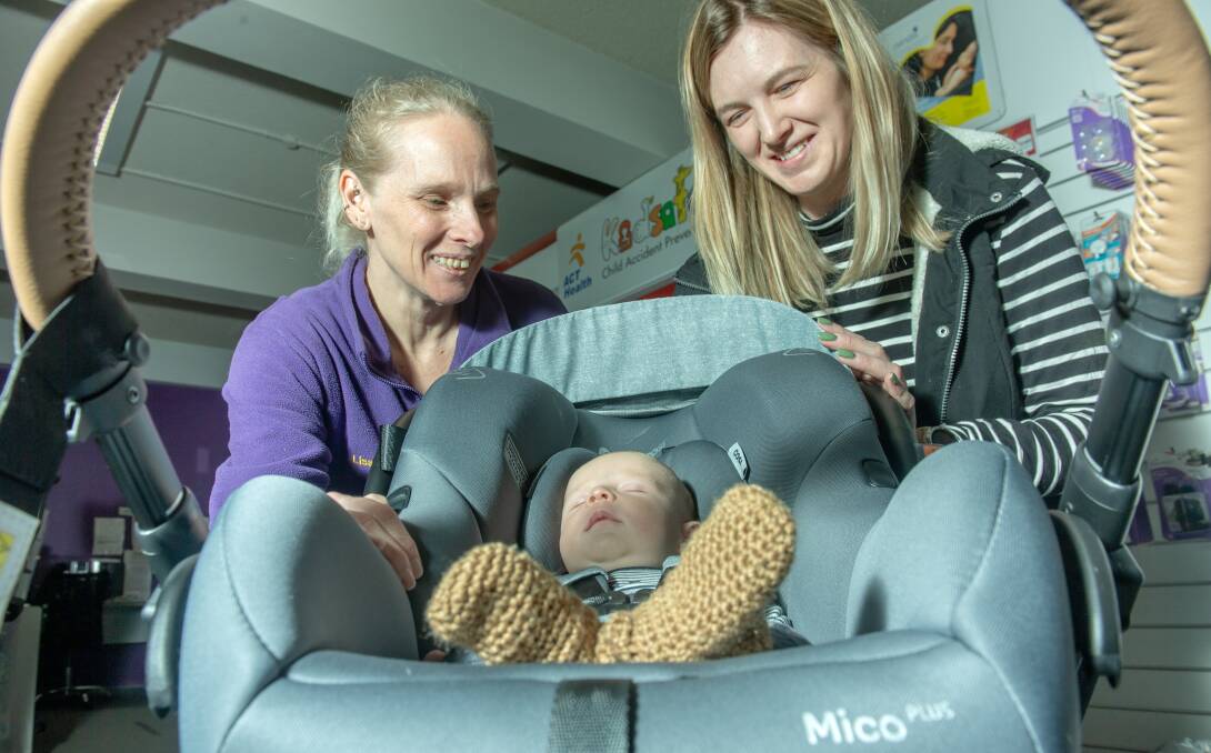 Kidsafe ACT manager Lisa Patterson (left) with Kayla Thompson and Kayla's son Jack Brice, five weeks. Picture: Karleen Minney