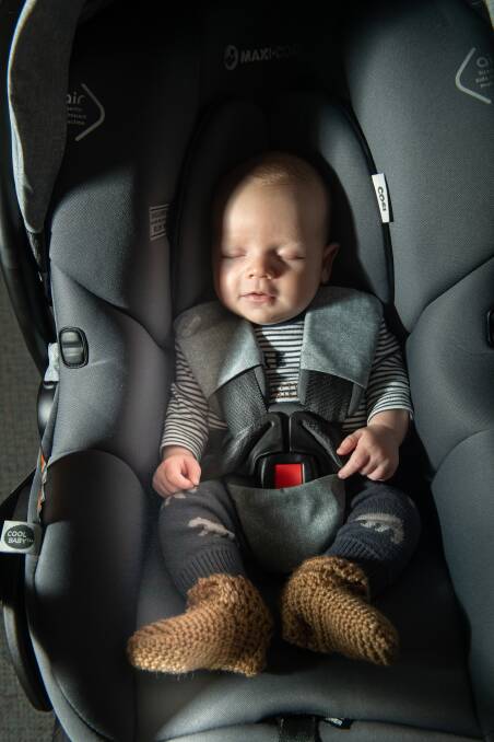 Five-week-old Jack Brice is fitted in to his car seat at Kidsafe ACT in Pearce. Picture: Karleen Minney