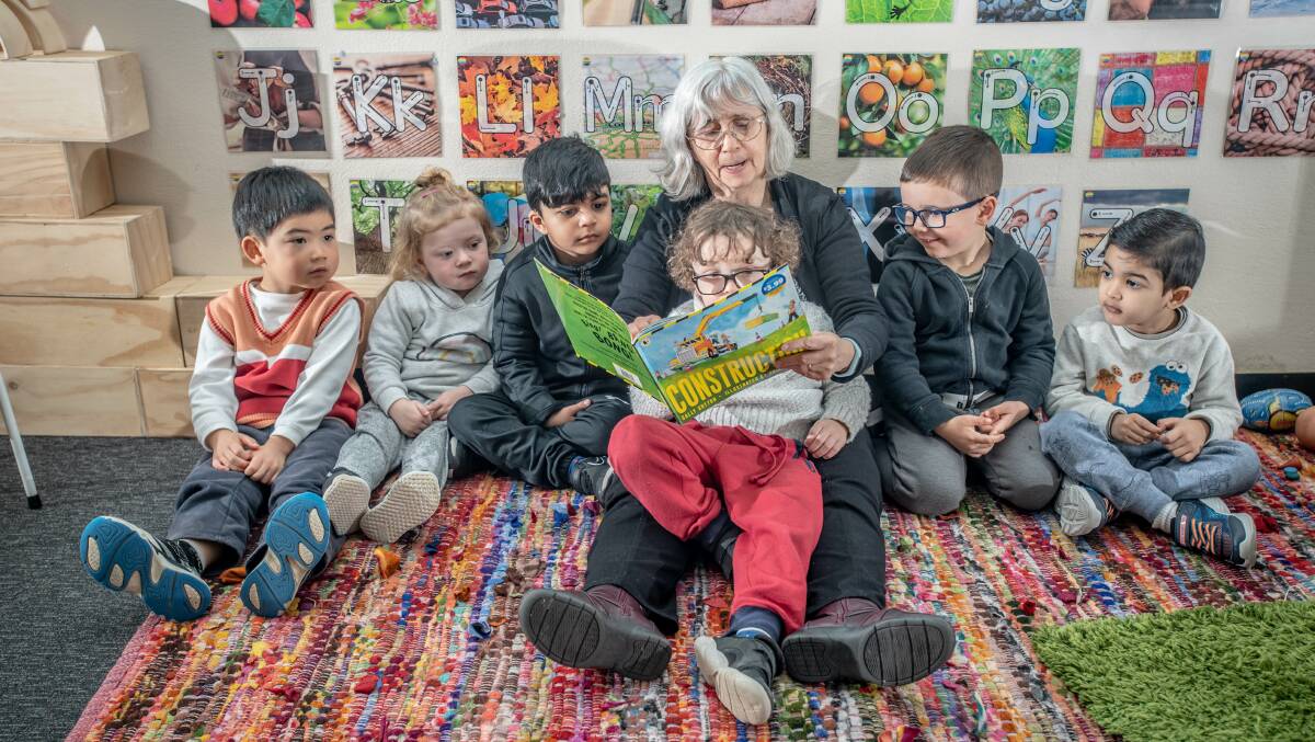 Stardust Childcare Centre Director Ros Thackray reads to pre-schoolers Charlie, Ella, Aaron, Eli, Oliver and Ahan. Picture: Karleen Minney