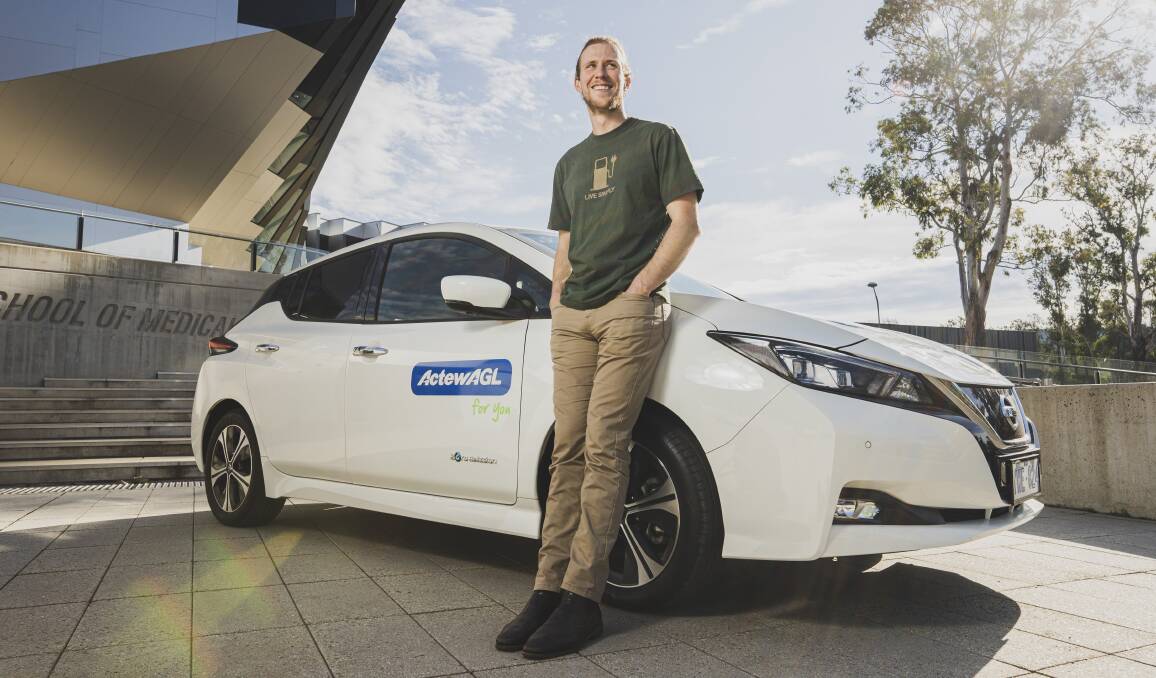 Bjorn Sturmberg, research leader at the ANU Battery Storage and Grid Integration Program, with an ActewAGL Nissan Leaf. Picture: Dion Georgopoulos