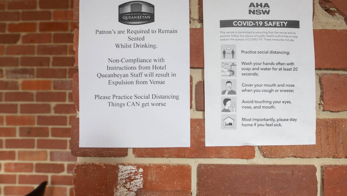 Signs up outside Hotel Queanbeyan explain the need for social distancing to patrons. Picture: Jamila Toderas