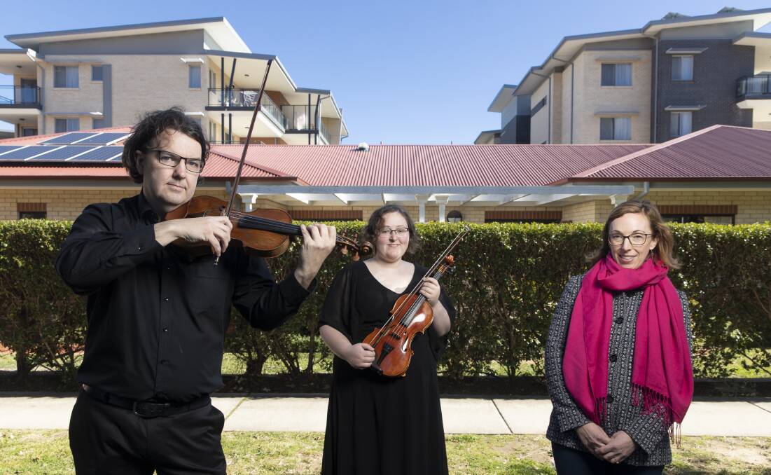 Canberra Symphony Orchestra violinists Tim Wickham and Lucy Macourit are taking part in the Music and Memory pilot program curated by Kristen Sutcliffe, where music is played to people with dementia to boost brain function. Picture: Sitthixay Ditthavong