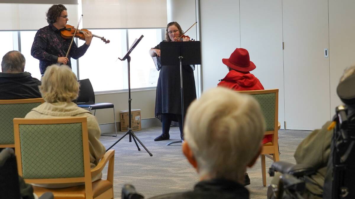 Tim Wickham and Lucy Macourit performing for dementia patients at Goodwin Village in Ainslie as part of the Music and Memory pilot program. Picture: Supplied