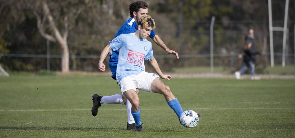 Belconnen United's Luca Florez and Olympic's Josh Calabria. Picture: Sitthixay Ditthavong