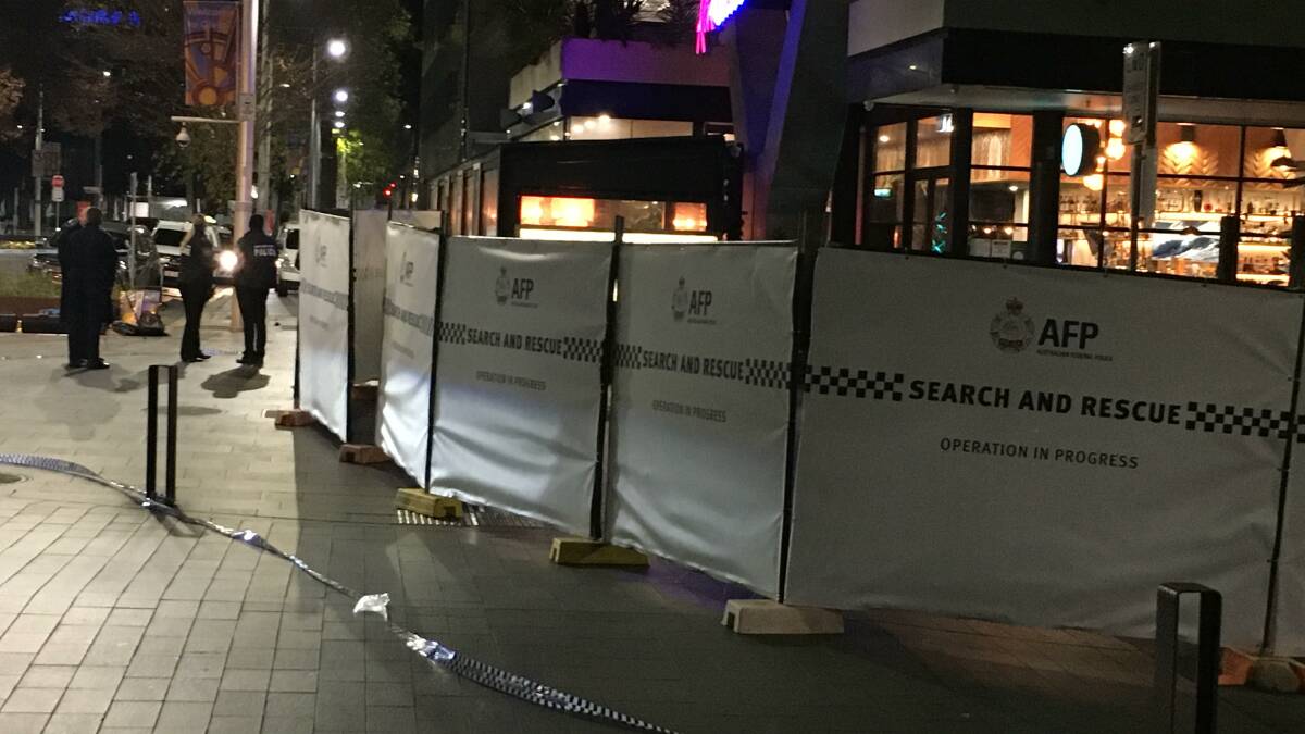 Police barriers protect the scene of the fatal incident in Canberra's city centre. Picture: Peter Brewer. 