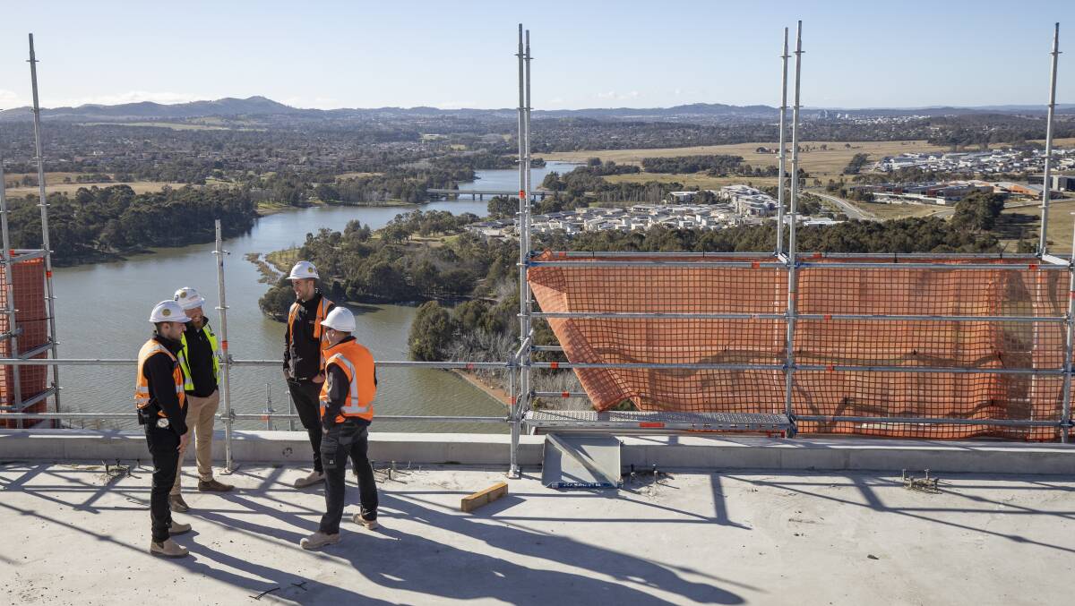 Senior project engineer Alex Cataldo, operations manager Damian Rumball, senior project manager Matt Lawson and site manager Tim Dygraff on top of Geocon's High Society building. Picture: Sitthixay Ditthavong 