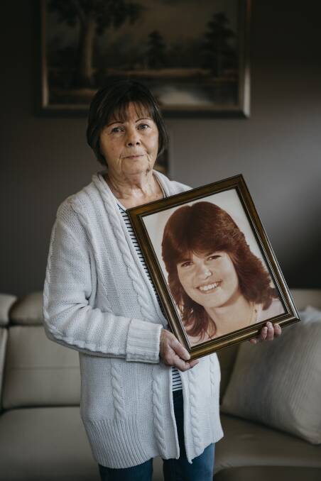 Dorothy Mulquiney holding a picture of her missing daughter Megan Mulquiney who disappeared from Woden Plaza on July 28, 1984. Picture: Dion Georgopoulos