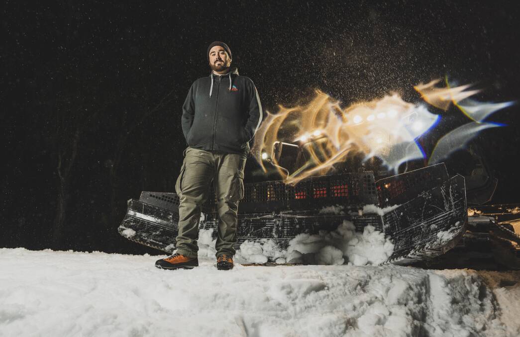 Jeremy Blake with his trusty snow cat, preparing for another night shift at Thredbo Alpine Resort. Pictures: Dion Georgopoulos
