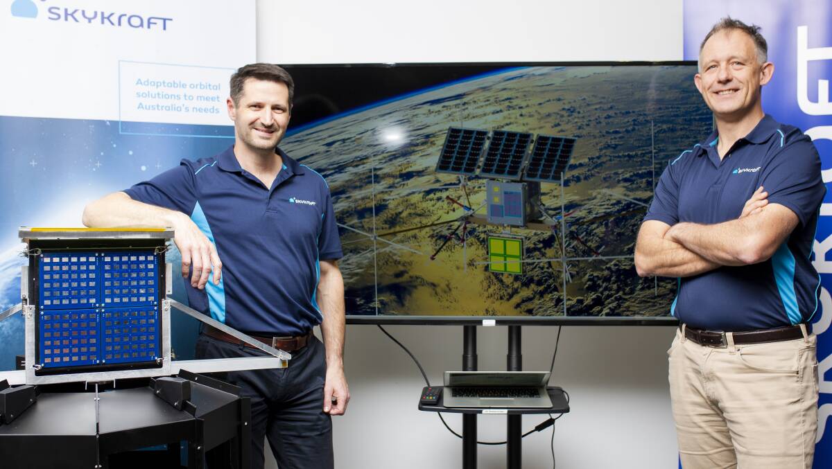 Canberra space company Skykraft founders, James Prior managing director, and Doug Griffin chief engineer, with the satellite - the company's prototype chassis. Picture: Jamila Toderas 