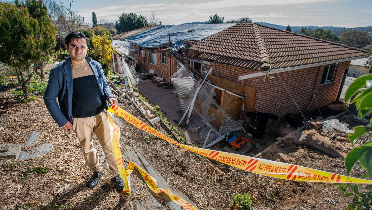 Bikram Subedi's application to remove a gum tree from his backyard in Calwell was refused just over a year before the tree came down in heavy winds on Monday. Picture: Karleen Minney