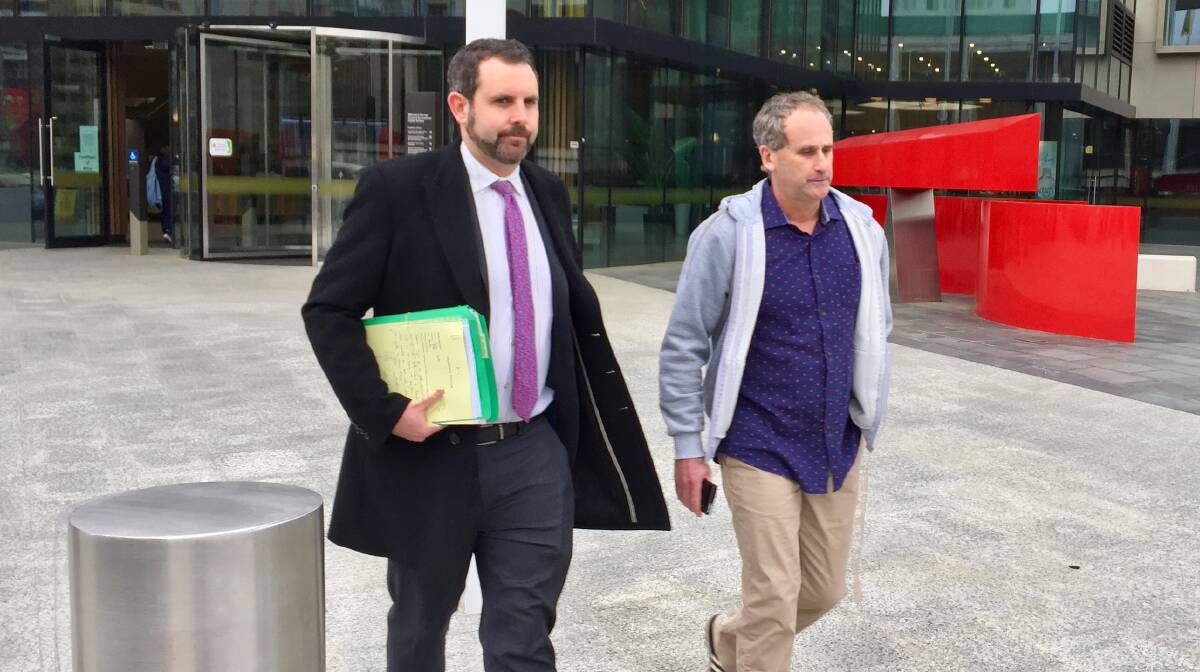 Stephen James Porter, right, leaves the ACT Magistrates Court with lawyer Adrian McKenna on Monday. Picture: Blake Foden