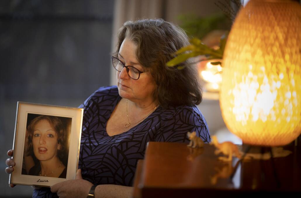 Beth Cassilles holds a photo of her long-term missing daughter Laura Haworth. Picture: Sitthixay Ditthavong