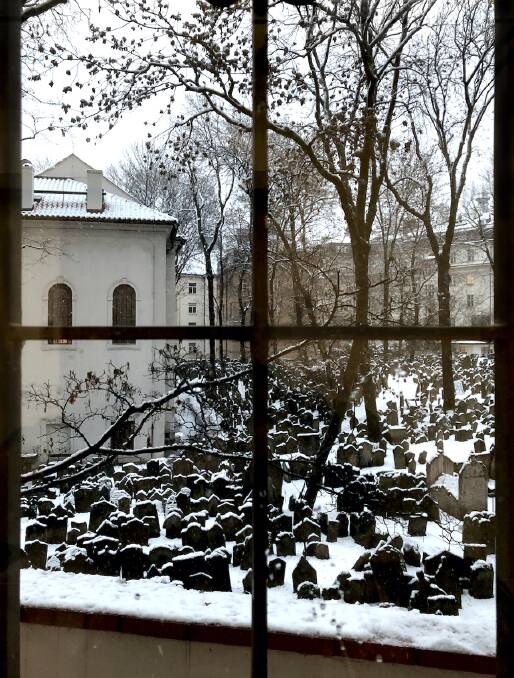 A Jewish cemetery in snowy Prague. 