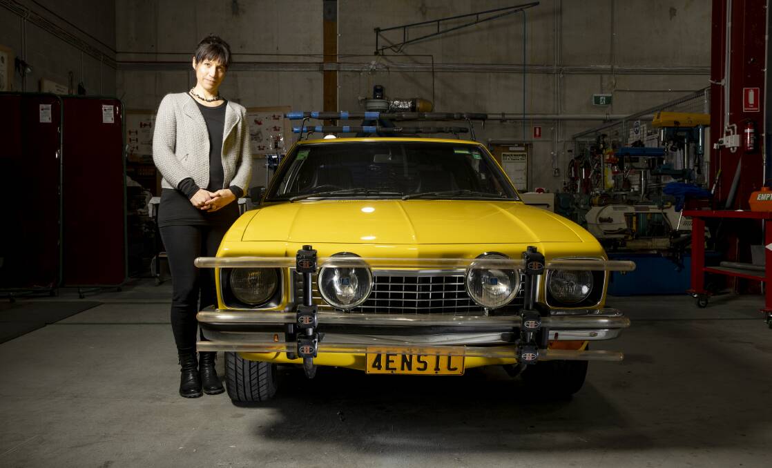 National Museum of Australia curator Sophie Jensen with Michael Chamberlain's Torana, which was torn apart by forensics in an effort to prove their case. The vehicle is going on display for the first time next week. Picture: Sitthixay Ditthavong