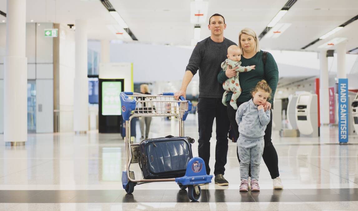 Michael Keogh and Victoria Keogh, with children Harry and Harper, flew to Queensland for a holiday before the border shut. Picture: Dion Georgopoulos 