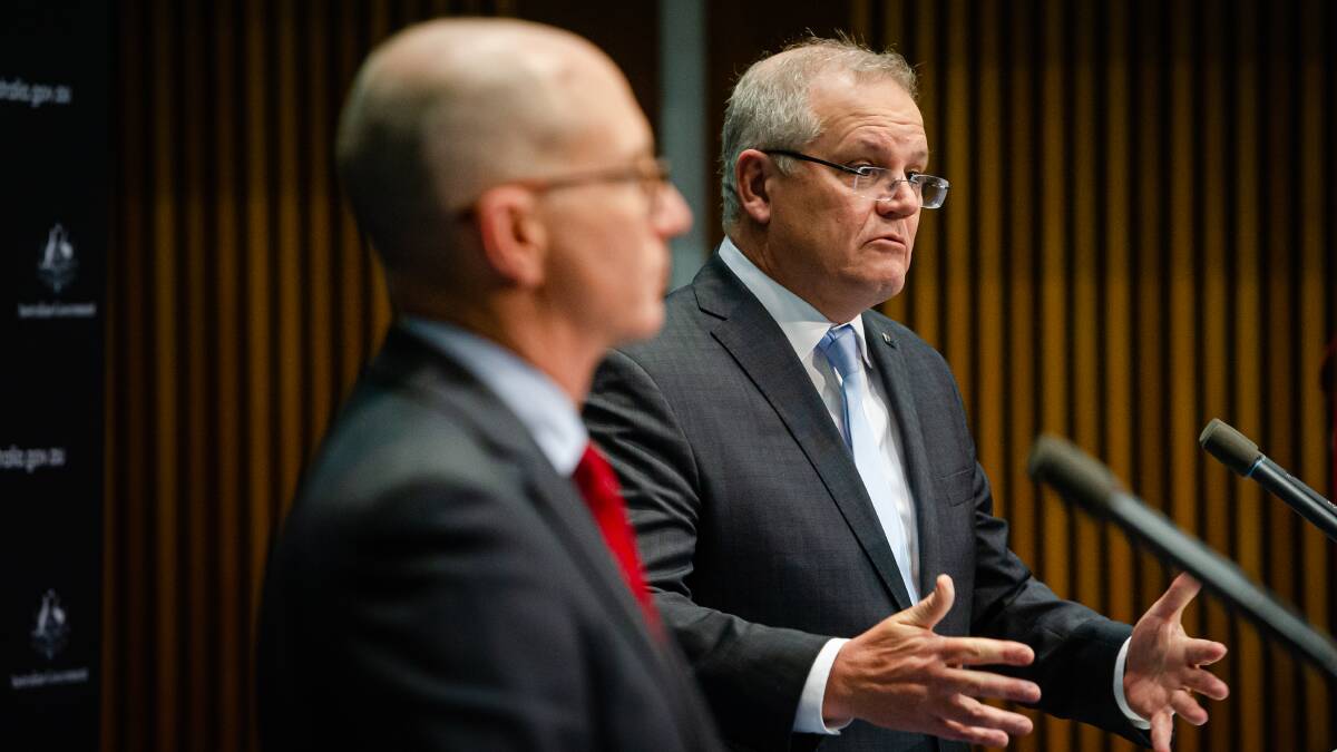 Prime Minister Scott Morrison (right) with acting chief health officer Paul Kelly. Picture: Elesa Kurtz
