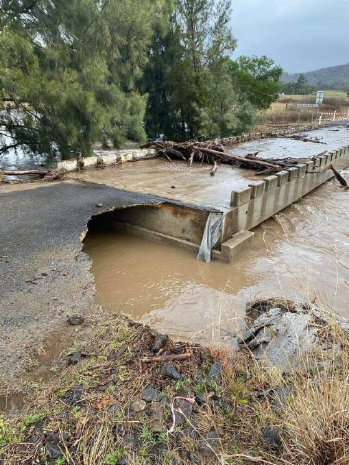 Parts of the Neringla Road crossing over the Araluen Creek have collapsed after heavy rain, trapping residents to the south. Picture: Matt Reeves