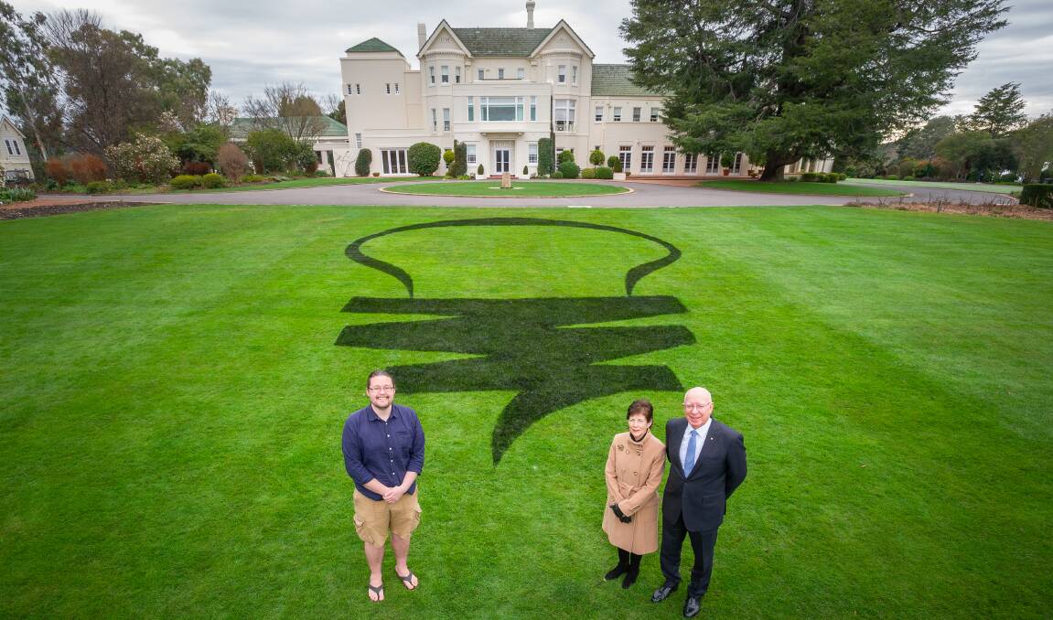 Governor-General David Hurley, right, with wife Linda Hurley and Dr Brad Tucker, left, on Government House's lawn. Picture: Elesa Kurtz
