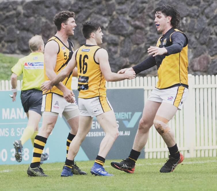 Queanbeyan's Rhys Pollock celebrates with his team after scoring a goal. Picture: Dion Georgopoulos