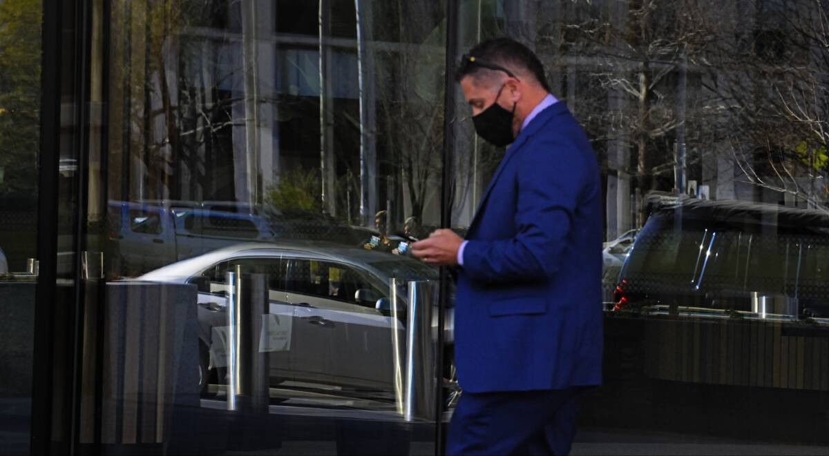 Suspended police officer Scott John White leaves the ACT Magistrates Court on Tuesday morning. Picture: Blake Foden