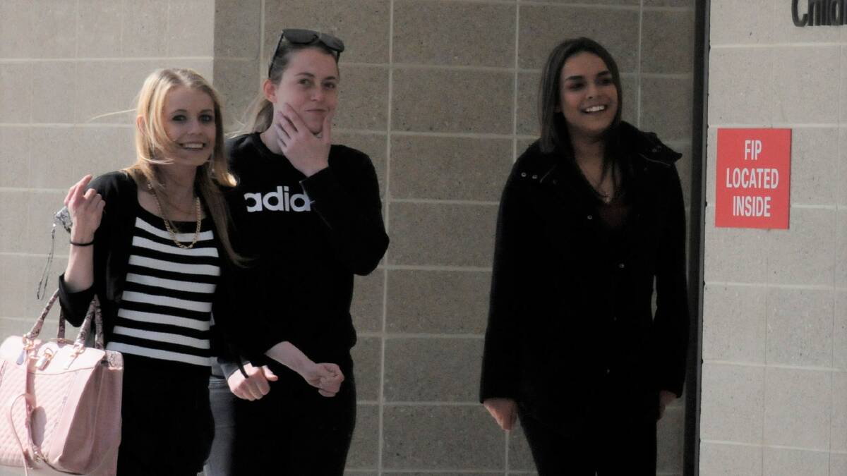 Isabella Denis, right, outside court with two supporters on the day of her sentencing. Picture: Blake Foden