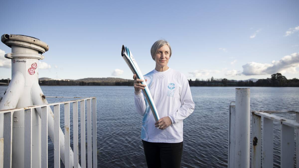 Gold medalist Megan Marcks says she had to train with her husband in order to prepare to row the torch across Lake Burley Griffin. Picture: Sitthixay Ditthavong