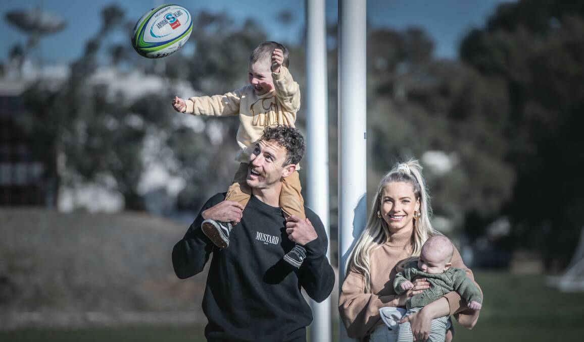Brumbies halfback Nic White with his wife Melissa, and sons Leo and Sonny. Picture: Karleen Minney