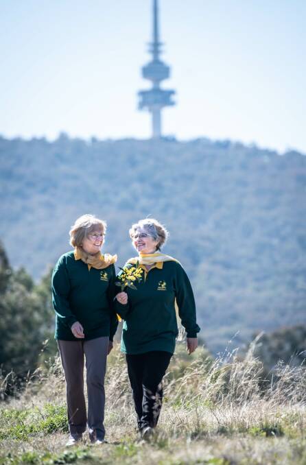 Wattle Day Association treasurer Judy Tunningley and president Suzette Searle are looking forward to Monday and Tuesday when landmarks such as Telstra Tower will light up in yellow for National Wattle Day. Picture: Karleen Minney