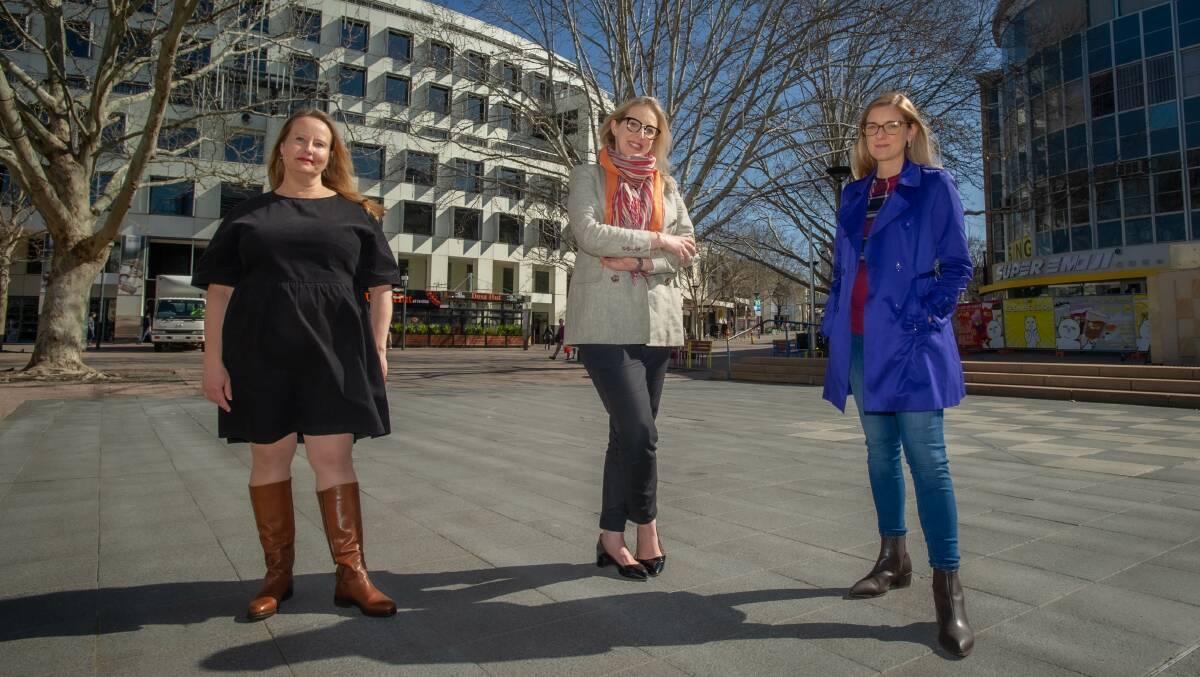 YWCA Canberra's Frances Crimmins, ACTCOSS's Emma Campbell and Women's Legal Centre ACT's Bethany Hender are urging action on the gender pay gap. Picture: Karleen Minney