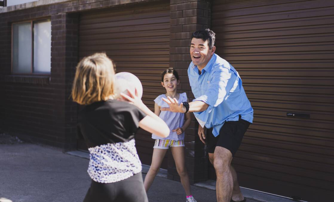 Chris Hart believes one of his most important roles as a dad is to encourage his daughters Georgie, nine, and Lily, eight, to have an active childhood. Picture: Dion Georgopoulos