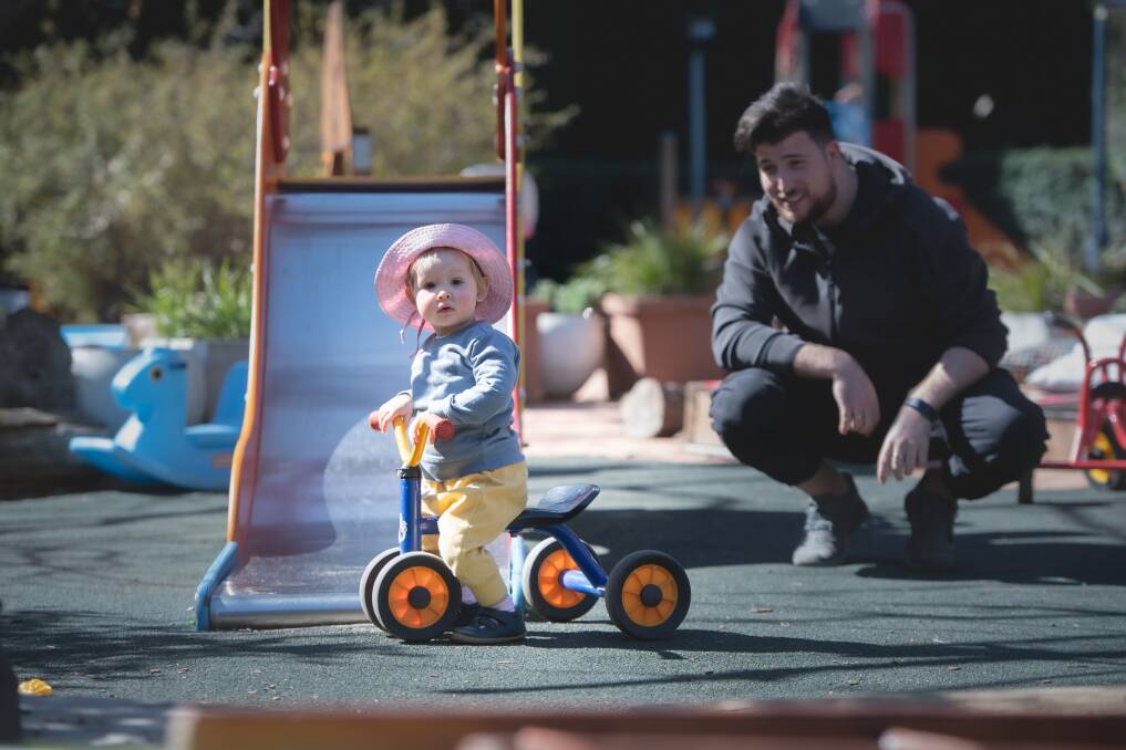Pippa Bromley, 21 months, with teacher Riccardo Martiniello at MOCCA early learning centre in Manuka. Picture: Karleen Minney