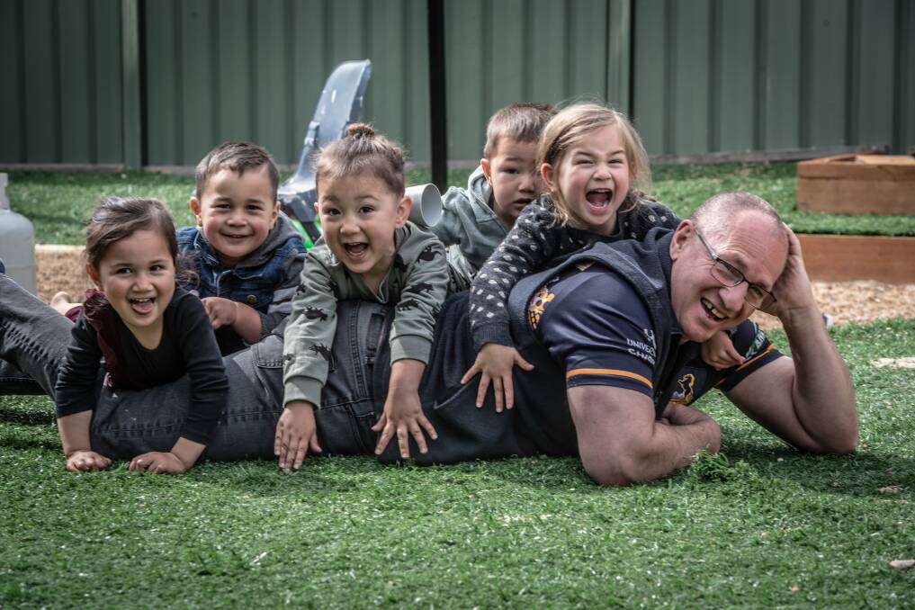 Brumbies operations manager Tony Abel with a five of his seventeen grandkids at home. Picture: Karleen Minney