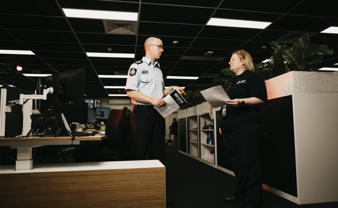 Detective Sergeant John Hawkins and field intelligence officer Mel Beard at the Operations Centre in Belconnen. Dion Georgopoulos