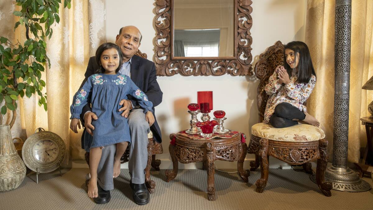 Mohammed Ali with his granddaughters Myra, 5, and Sana, 8. Picture: Sitthixay Ditthavong