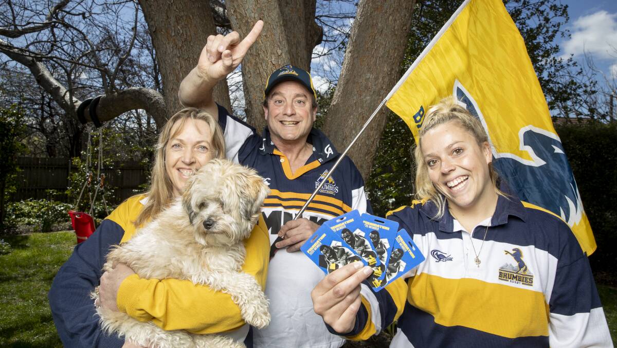 Brumbies season ticket holders Jody, Jim, and Beth Taylor are ready for the home final. Picture: Sitthixay Ditthavong