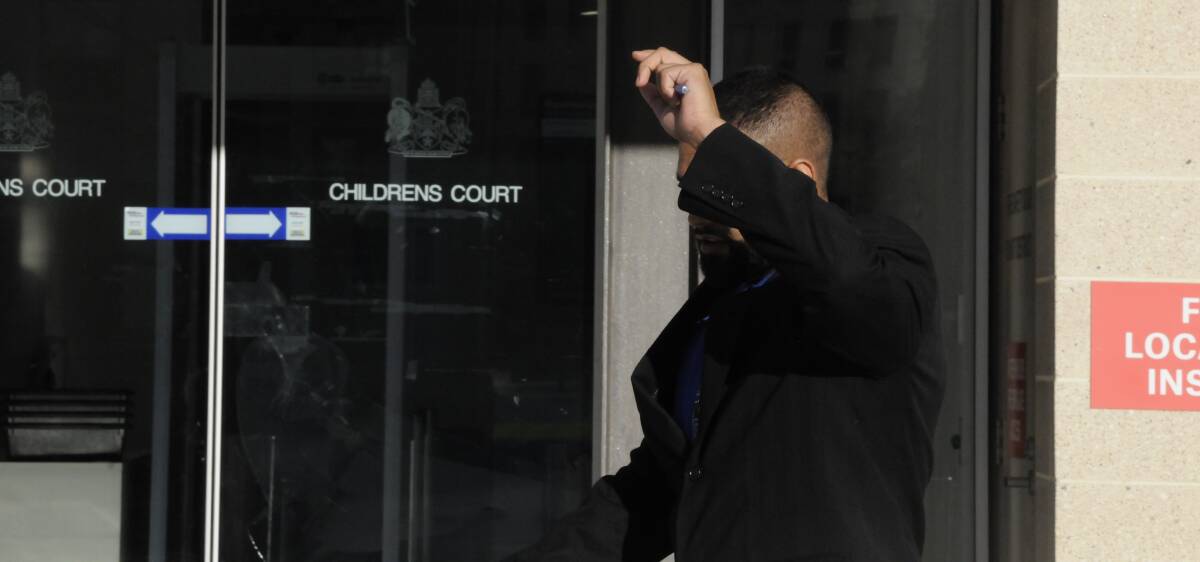 Kerrod Edwards shields his face outside court. Picture: Blake Foden