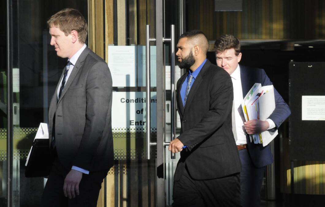Kerrod Edwards, centre, leaves the ACT Supreme Court with his lawyers following day one of his trial. Picture: Blake Foden