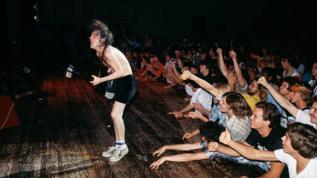 Angus Young, AC/DC, in LA in 1978, by Rennie Ellis. Picture: National Portrait Gallery